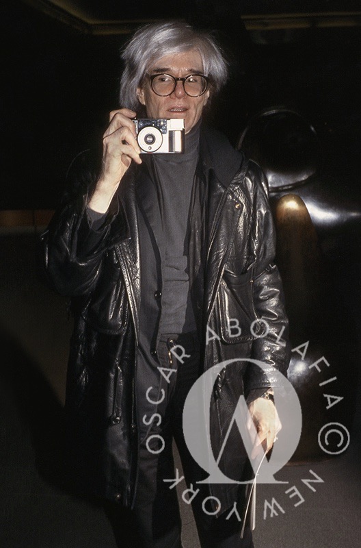 Andy Warhol with camera